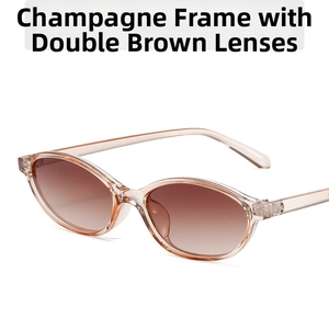 Detail view of oval champagne frames with brown gradient lenses on vintage sunglasses