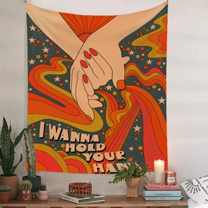 Close-up of 70s Pop Art tapestry with 'I WANNA HOLD YOUR HAND' text on a white wall