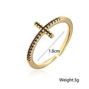 Detail showing the 18K gold plated cross ring with micro-set black cubic zirconia stones