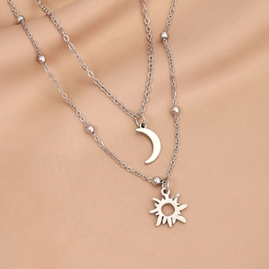 Double-layered silver sun and moon pendant necklace with delicate bead chain accents