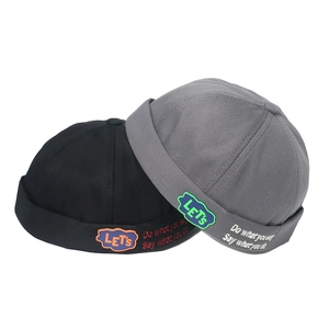 Black and grey brimless landlord hats with 'LET'S' embroidery in twill cotton fabric