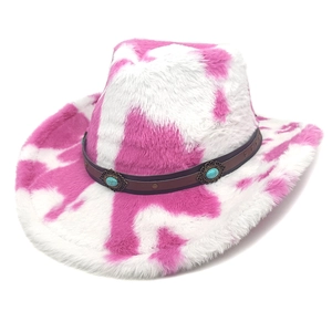 Detail of pink cow print plush cowboy hat with turquoise studded brown leather band