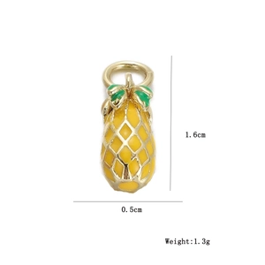 Detail view of a pineapple charm with yellow and green enamel finish and gold edges
