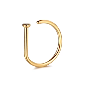 Detailed view of single gold D-shaped nose ring with polished metallic finish on white back