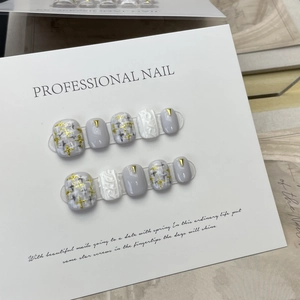 Handmade press-on nails with 3D embossed flowers and chic tweed texture in grey tones