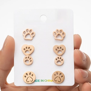Set of 4 rose gold stainless steel stud earrings featuring hollow pet paw and heart designs