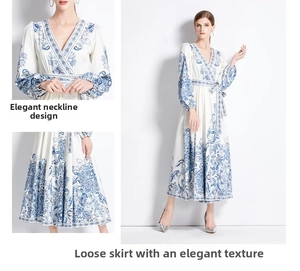 Detail view of V-neck design and blue floral pattern on long-sleeved midi dress