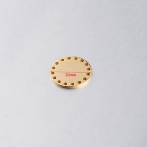 Detailed top view of a 20mm golden stainless steel round disc charm with perforated edges