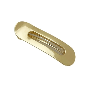 Minimalist gold alloy hair clip with oval cutout design on a clean white background