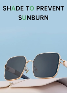 Detailed low angle view of stylish golden square metal frame sunglasses with grey lenses