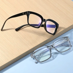 Square anti-blue light glasses in black and transparent frames with stylish rivet details