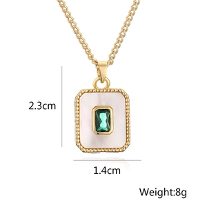Detail of 18K gold pendant with white shell and green gemstone, 2.3cm x 1.4cm size
