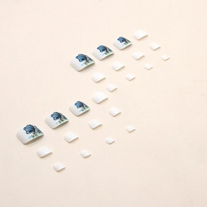 Fresh 3D butterfly press-on toenails with blue butterfly and floral designs on white base