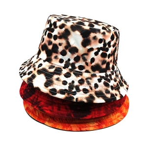 Stacked collection of leopard print and gradient tie-dye reversible bucket hats