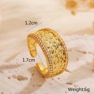 Detail shot of a 1.2cm wide gold-plated hammered ring with cubic zirconia accents