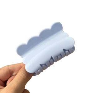 Elegant light blue wavy hair claw clip made of durable plastic in a sweet candy color