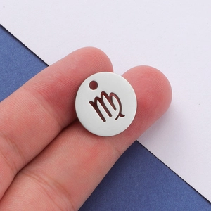 Polished stainless steel round pendant featuring a cutout Virgo constellation symbol