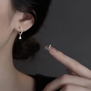 Elegant S925 sterling silver geometric hoop earrings with zircon drops on a model