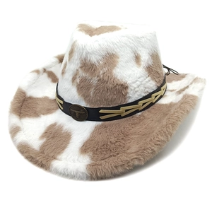 Close-up of cow print faux fur cowboy hat with leather band and bronze bull head emblem