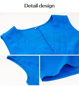 Detailed view of blue V-neck top with layered ruffles and high-quality edge stitching