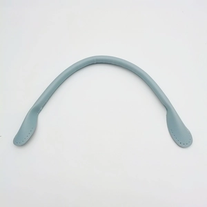 Detail shot of light blue thickened leather handbag handle with stitching for DIY replacement