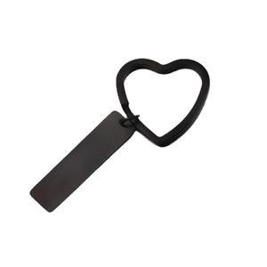 Black heart-shaped metal keychain with engravable rectangular tag in a minimalist design