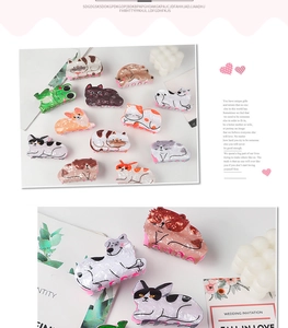 Detailed close-up of colorful acetate animal hair clips featuring cat and corgi shapes