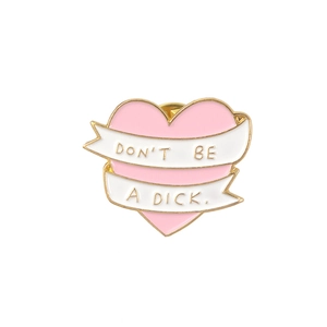 Pink enamel heart brooch with gold metal edge and Don't Be A Dick slogan ribbon