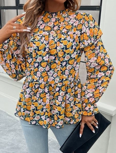 Detailed view of floral print blouse with high ruffled collar and layered ruffled hemline