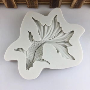 Macro shot of koi fish silicone mold showing intricate tail fin textures for cake decor