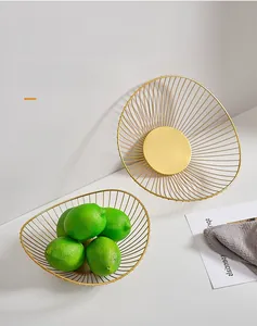 Detail view of gold iron wire mesh fruit baskets with minimalist hollow ventilation design