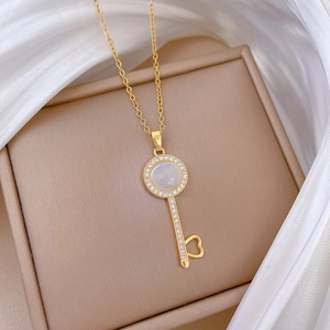 Elegant gold titanium steel necklace with opal key pendant and sparkling crystals
