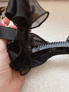Detail of black double-layered mesh bow banana clip with Made in Korea engraving