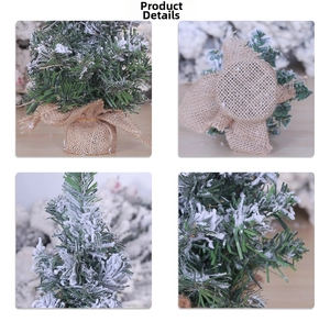 Detail of mini snow-flocked Christmas tree with pine needles and burlap wrapped base
