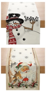 Detailed view of Christmas table runners with snowman and Santa claus festive print