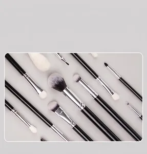 Macro shot of 40 professional makeup brushes with soft bristles and black glossy handles