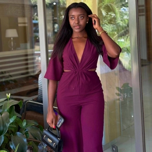 Deep V-neck cut-out jumpsuit in dark purple with long sleeves and wide leg design