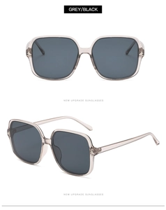Detail of oversized square grey translucent sunglasses with durable metal hinges