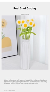 Detail of handmade crochet daisy bouquet with yellow centers and white petals