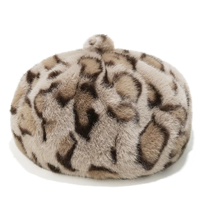 Detailed close-up of faux mink leopard print beret showing soft plush texture and pom-pom