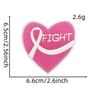 Close-up of pink heart embroidery patch with white ribbon and Fight text detail