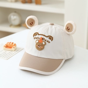 Detailed close-up of child baseball cap with cute bear ears and Hello Bear embroidery