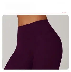 Detail of high-waist tummy control yoga pants in dark purple with seamless elastic fabric