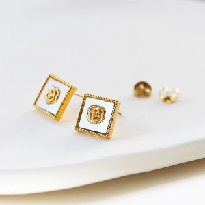 Retro gold square earrings with white mother-of-pearl base and detailed rose embossing