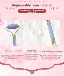 Detail of purple resin facial roller with smooth edges and golden metal bracket