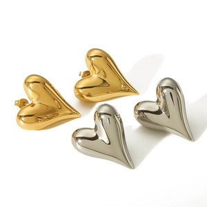 Polished 18K gold and silver heart-shaped stainless steel earrings on white background