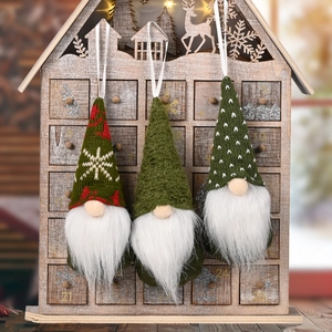 Three Christmas knitted gnome hanging ornaments in red and green for tree decoration
