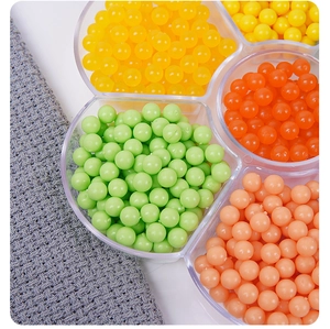 Close-up of colorful resin balls in floral organizer for DIY dessert toy decoration