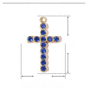 Detail of cross pendant in gold stainless steel with zircon, 16x10mm size and 0.5g weight