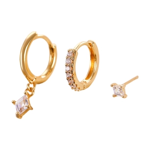 Three-piece gold earring set with rhombus pendants and clear cubic zirconia in detail